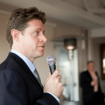 Image of Greg Corfield holding a microphone