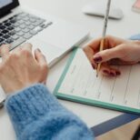 Small business owner working with website developers on laptop