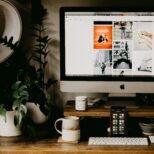 Founder reviewing first business website with web designer