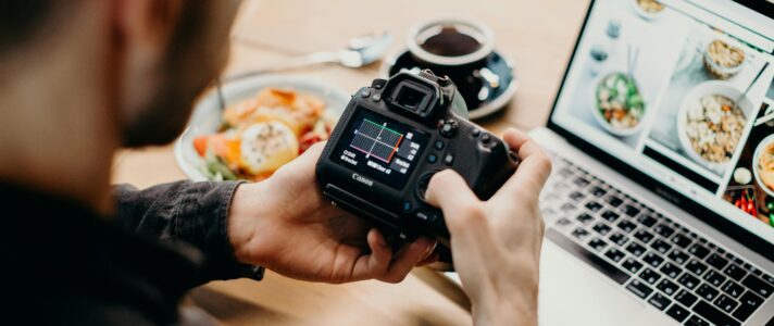 Business owner reviewing web design pricing and value checklist with designer