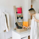 Website designer mapping buyer journey stages on whiteboard for small business